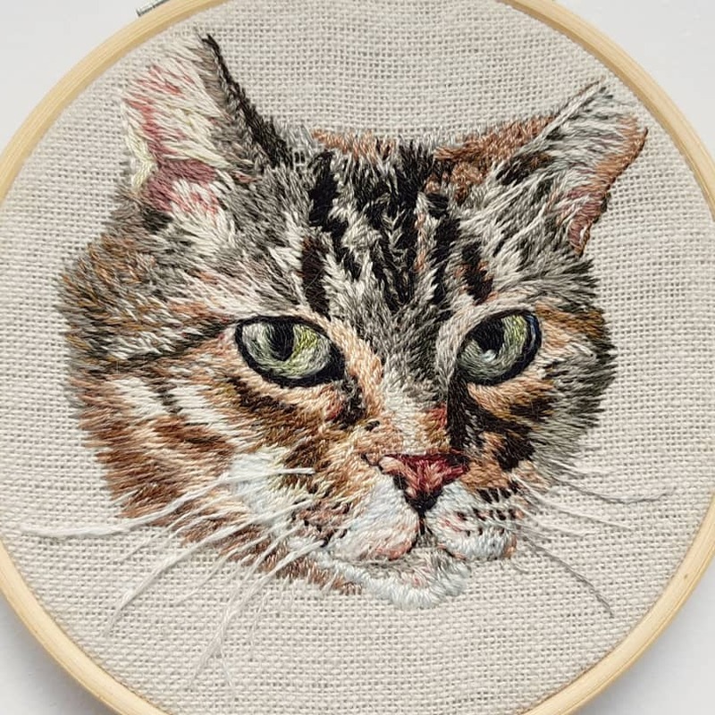 Hand embroidered pet portrait of a good girl